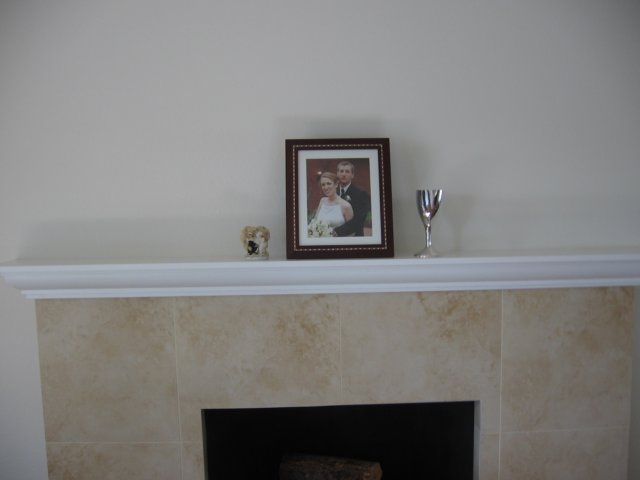havingourweddingthingsonthemantle.jpg